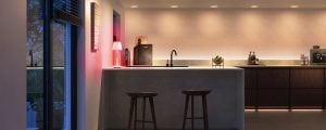 A kitchen counter lit in bright white tones of smart light.