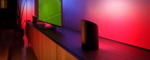A spotlight of the Hue Play Wall Washer, lighting up the walls in tones of Pink and Blue, with the effects of the Hue Sports Live feature.