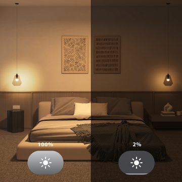 A comparison of two Hue smart lights in a bedroom - one dimmed to a cozy 2% of total brightness, the other shining brightly at 100%.