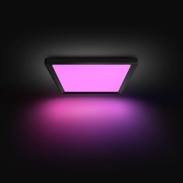 Hue Tento smart LED-panel med lilla lys på sort baggrund
