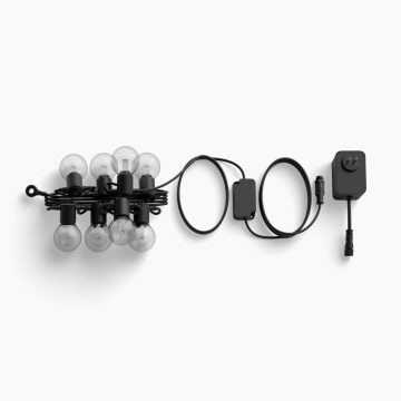 A string of Festavia outdoor globe party lights with transparent lightguide bulbs, black cable, and Low-volt power supply unit