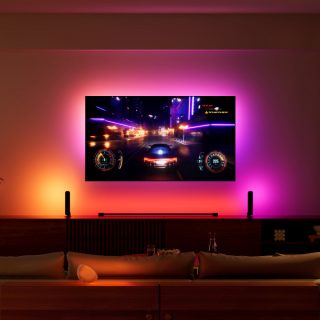 TV playing racing game in living room with pink and red lights