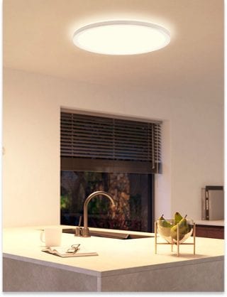 Modern kitchen illuminated by a Philips Hue round ceiling panel light providing bright, white functional light.