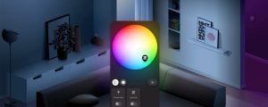 Smart lighting app interface showing a color selection wheel, brightness button, and options for vintage light and lightstrip.