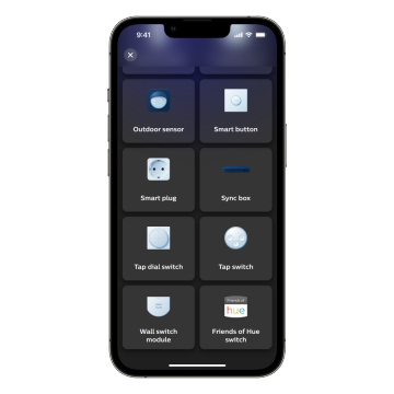 A smartphone screen displays an app interface with options: Outdoor sensor, Smart button, Smart plug, Sync box, Tap dial switch, Tap switch, Wall switch module, Friends of Hue switch.