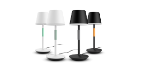 A set of smart table lamps in white and black finishes, featuring similar modern designs with colored accents on the stems.