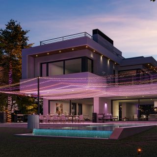 Modern house with outdoor dining area and pool, illuminated by strings of soft, colorful smart lighting creating an ambient evening scene.