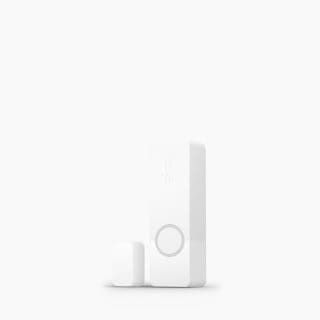 White rectangular smart security contact sensor with matte finish, compact design, circular feature, and embossed ""hue"" text.