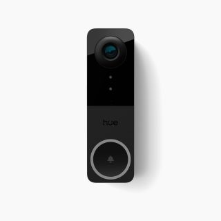 Rectangular black video doorbell with a glossy finish, camera lens at the top, circular button with bell icon, and visible ""hue"" text.