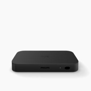 Black rectangular sync box with matte finish, compact design, visible port and indicator light on the front panel.